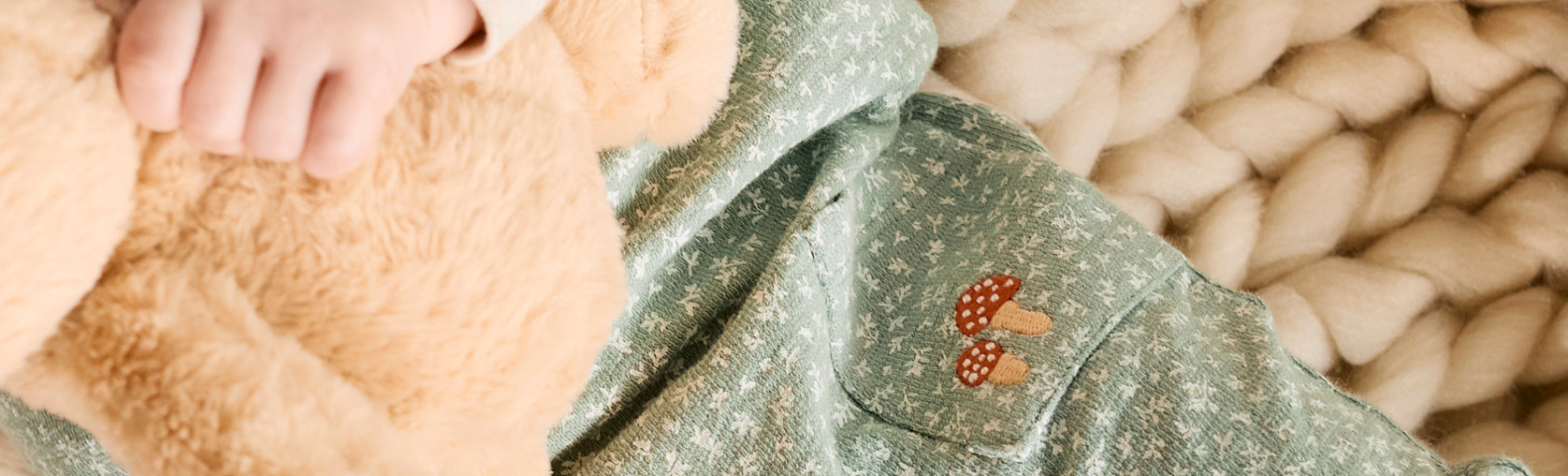 How to Build a Gender-Neutral Baby Wardrobe That Grows with Them